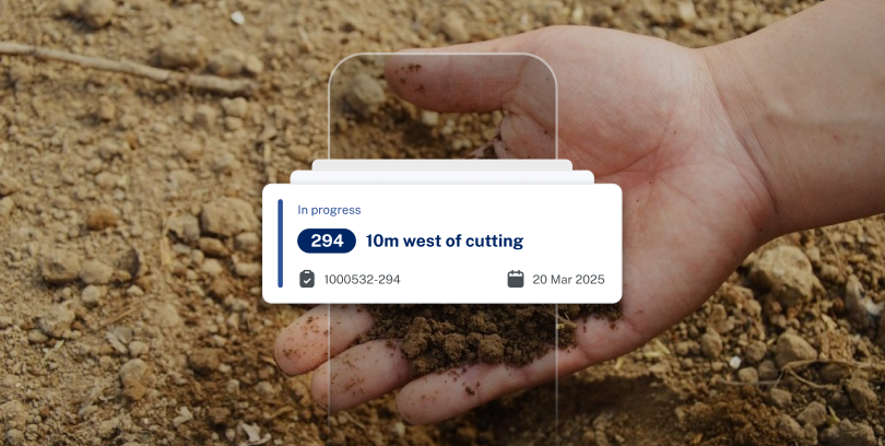 Hand holding a little bit of dirt